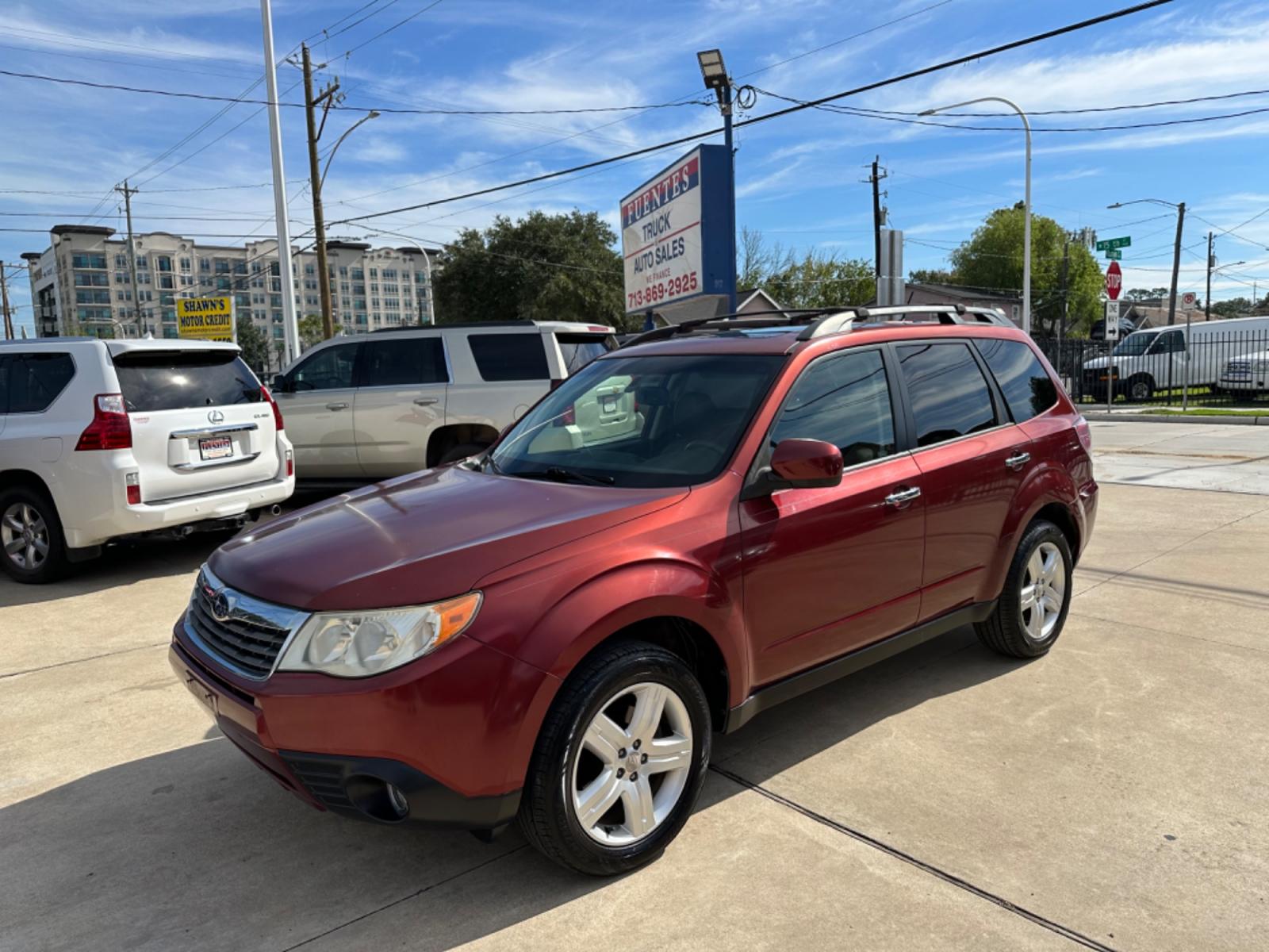2009 Red /Black Subaru Forester X Limited (JF2SH64619H) with an 2.5 engine, Automatic transmission, located at 1501 West 15th St., Houston, 77008, (713) 869-2925, 29.797941, -95.411789 - Photo #0